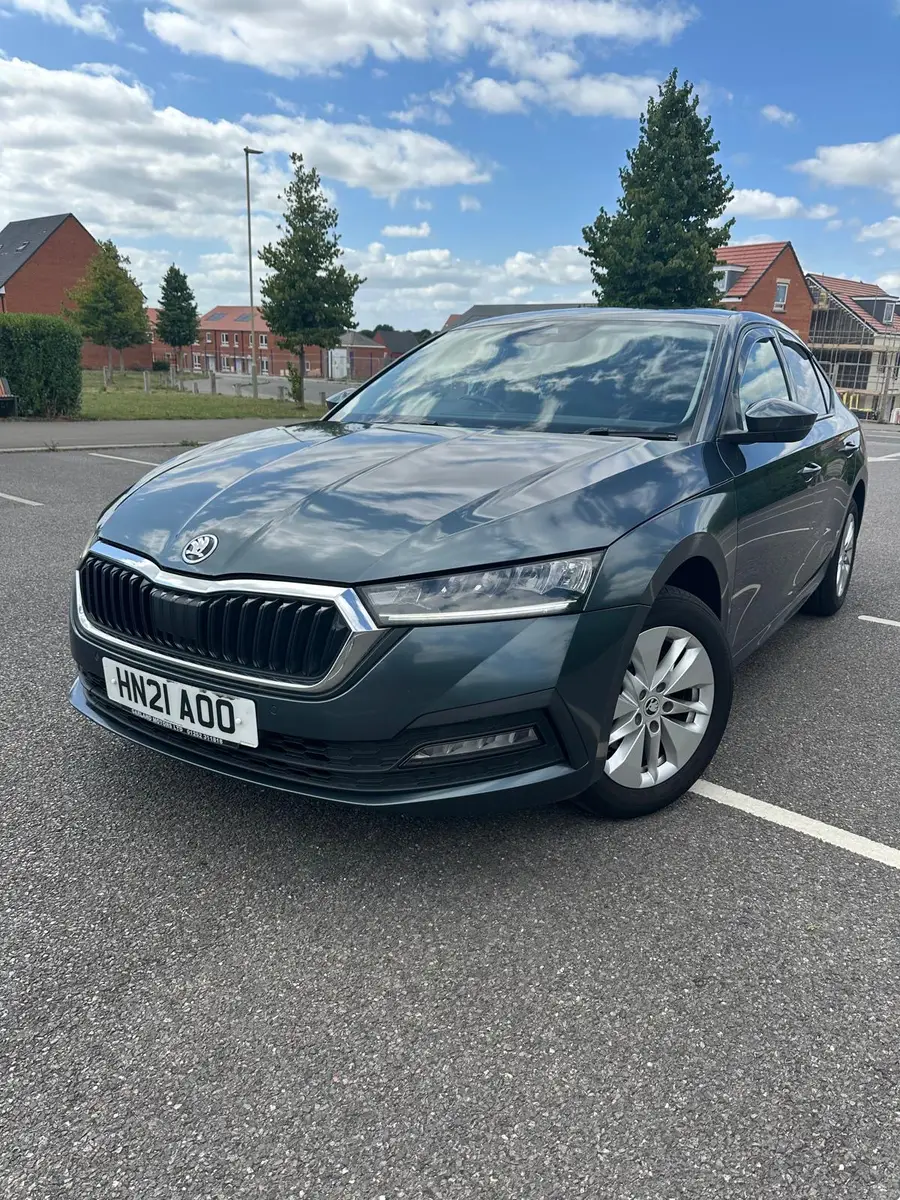 Grey car parked on a sunny day